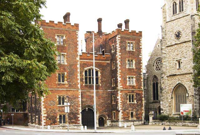 The tall red brick gateway of Lambeth Palace marks the entry into the official residence of the Archbishop of Canterbury